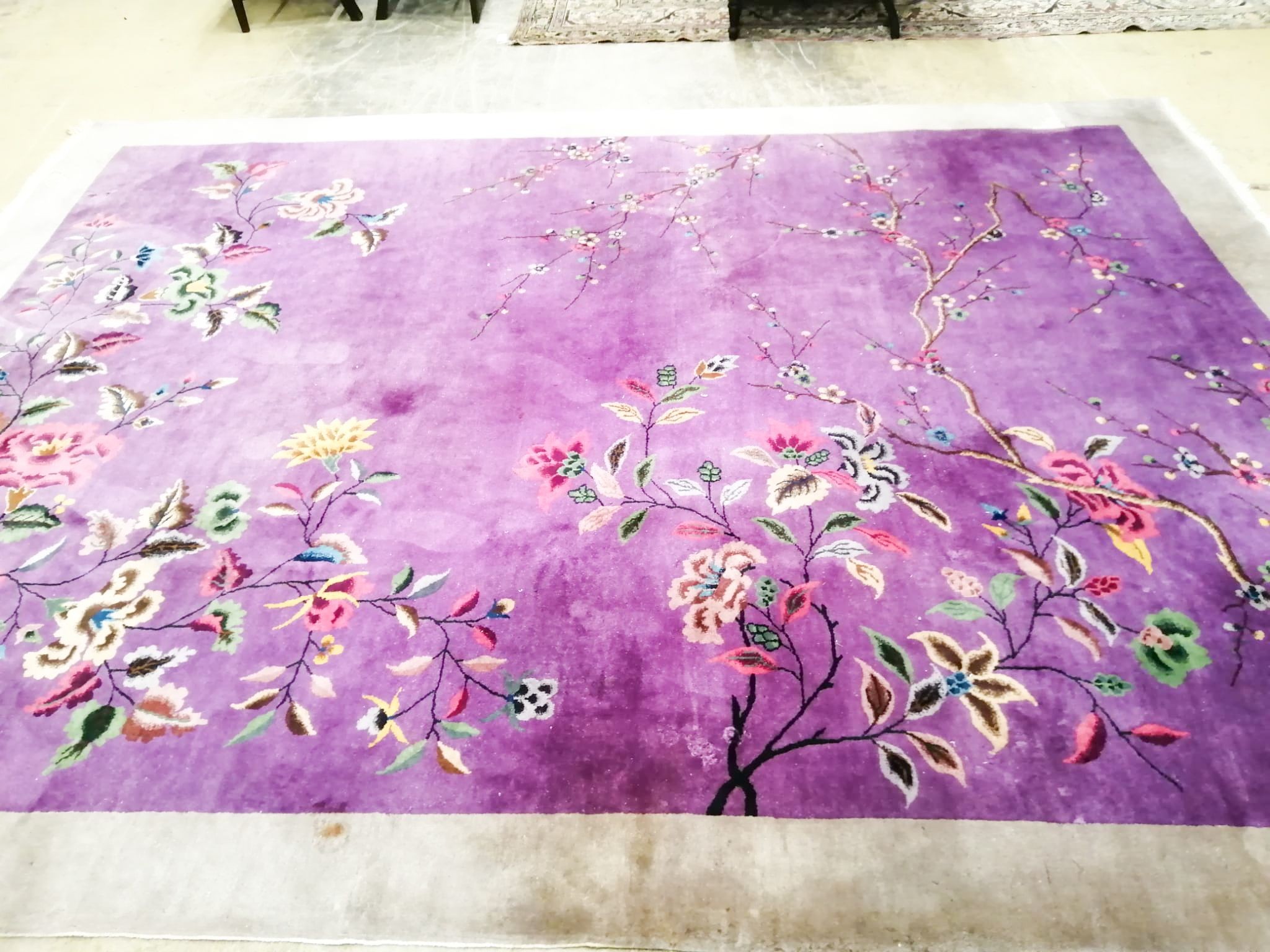 An early 20th century Chinese mauve ground carpet, 360 x 270cm